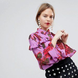 Pink Blouse With Ruffle Trim and Bold Floral Print